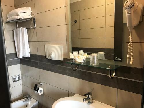 Koupelna v ubytování Hotel Visagi