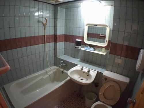 Koupelna v ubytování Yi Yuan Hotel