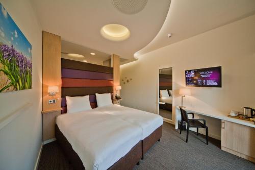 Postel nebo postele na pokoji v ubytování Hotel Udens Duyn