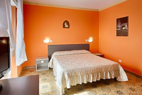 Кровать или кровати в номере Albergo Mancuso del Voison