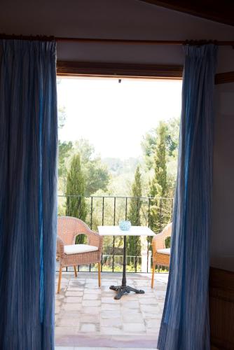 a view of a patio with a table and chairs at Agroturisme Perola - Only Adults in Llucmajor
