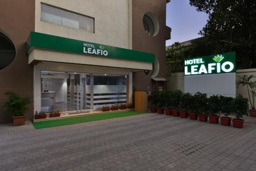a building with a sign for a hotel leedia at Hotel Leafio-Near Airport in Mumbai