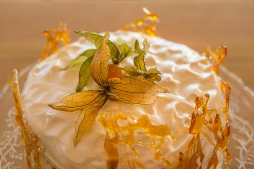 a cake with flowers on top of it at Northern Light Inn in Grindavík