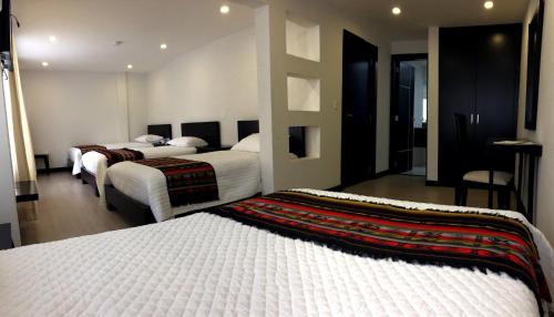 Ένα ή περισσότερα κρεβάτια σε δωμάτιο στο Hostal Entre Ríos
