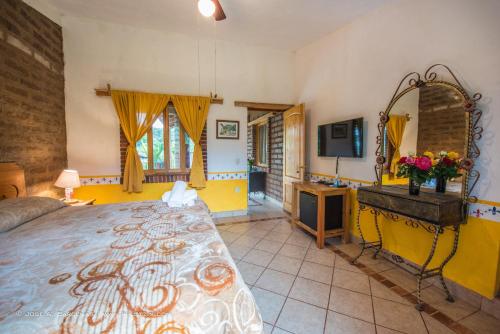 Ένα ή περισσότερα κρεβάτια σε δωμάτιο στο Hotel Casa Pomarrosa