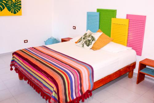 เตียงในห้องที่ Vainilla Bed and Breakfast Mexico