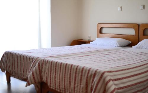 Un ou plusieurs lits dans un hébergement de l'établissement Filareti Hotel