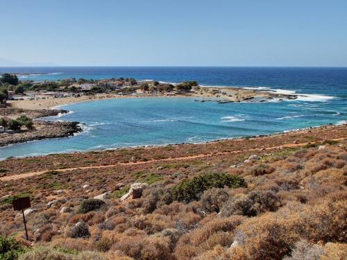 an island in the ocean next to a beach at Anni House in Stavros in Stavros