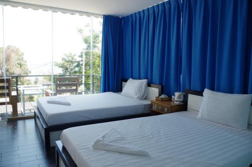 Tempat tidur dalam kamar di Koh Rong Ocean View Bungalow