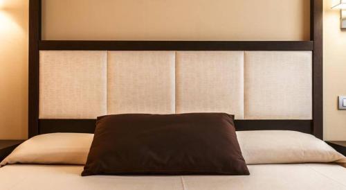 A bed or beds in a room at Hotel Zen