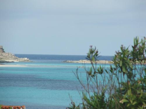 a view of the ocean from a beach at B&B MrCaruba in Stintino
