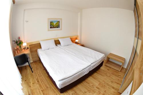a bedroom with a white bed in a room at Boutique Villa Arte in Ohrid