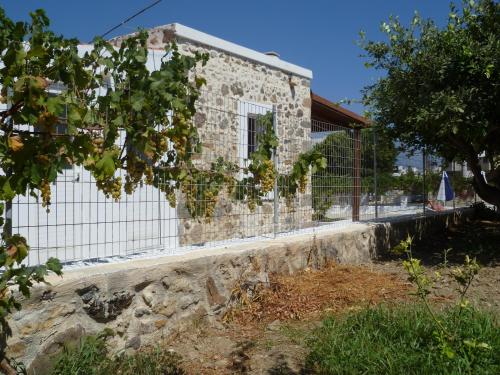 a building with a fence in front of it at Paraschos Studios Kos in Kardamaina