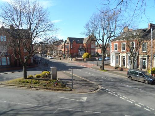 an empty street in a town with buildings at Warwick Lodge in Carlisle