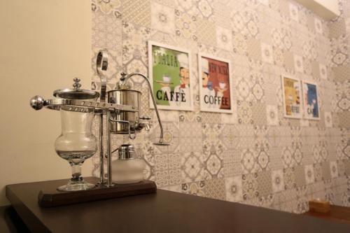 a table with a glass appliance on top of it at Aria 2 Home (With Elevator) in Hualien City
