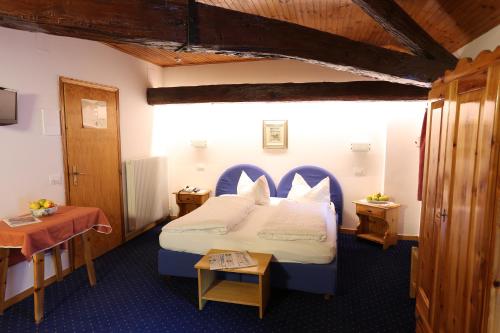 Postel nebo postele na pokoji v ubytování Albergo Due Spade