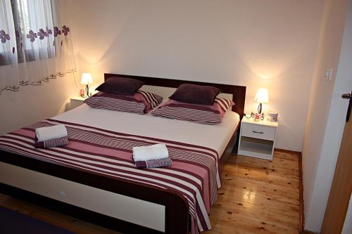 Postel nebo postele na pokoji v ubytování Apartment Ana
