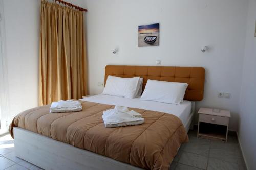 Ένα ή περισσότερα κρεβάτια σε δωμάτιο στο Kappatos Studios & Apartments
