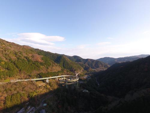 a bridge in the middle of a valley at Amagiso in Kawazu