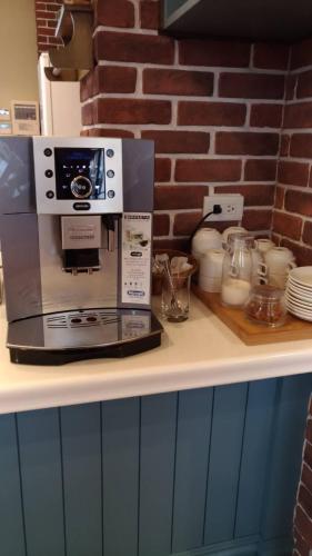 a coffee maker sitting on top of a counter at Charmole in Wujie