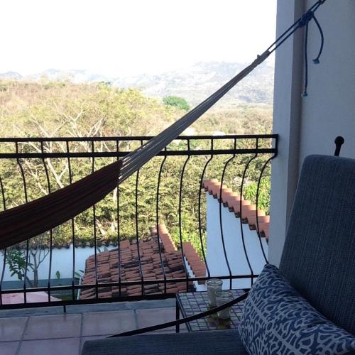 a balcony with a view of a body of water at Terramaya Boutique Hotel in Copan Ruinas