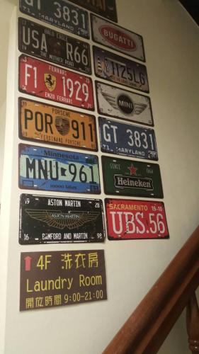 a wall of street signs on a wall at 角舍背包客棧 -近火車站 in Hualien City