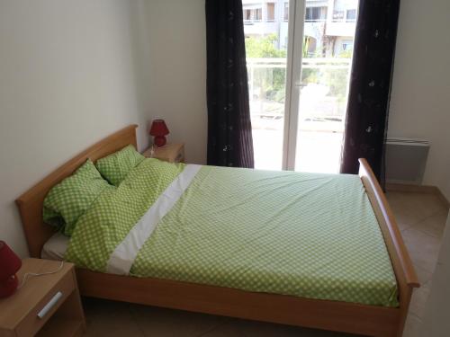 Postel nebo postele na pokoji v ubytování Appartement Les Alizés