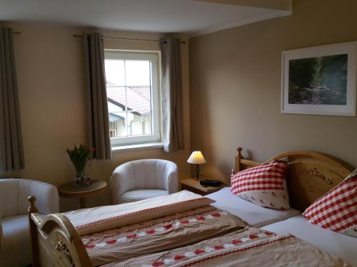 מיטה או מיטות בחדר ב-Hotel Garni Haus Sonneneck