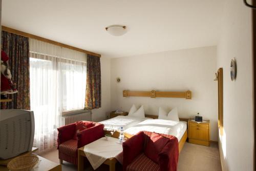מיטה או מיטות בחדר ב-Dorf gut Hotel zur Warte