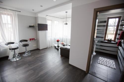 a living room with a couch and a table at Park Apartments in Valmiera
