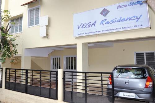 a car parked in front of a villa at Vega Residency in Bangalore