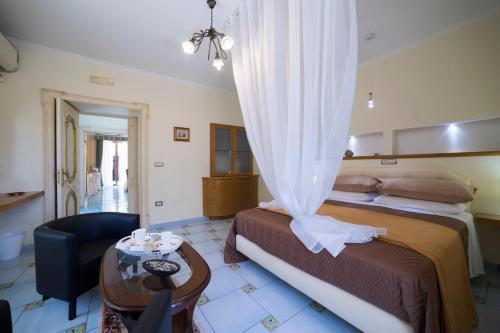 A bed or beds in a room at B&B 'O Sole Mio!