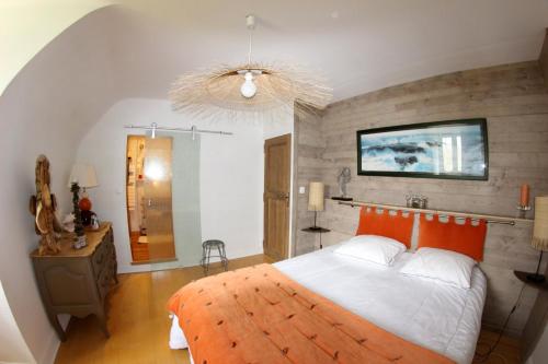 En eller flere senge i et værelse på La maison de l'Odet