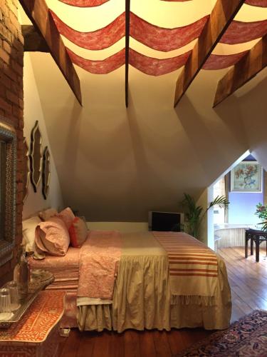 a bedroom with a bed with an american flag on the ceiling at 10 Clarke in Frederick