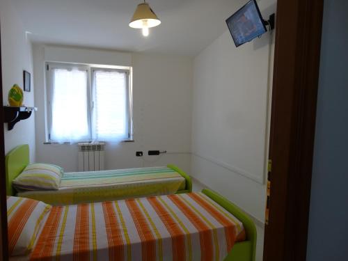 Postel nebo postele na pokoji v ubytování Appartamento La Collinetta