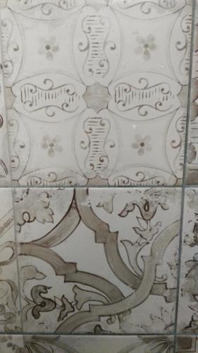 a white tile floor with a design on it at CASA ANNIO Holiday Viterbo in Viterbo
