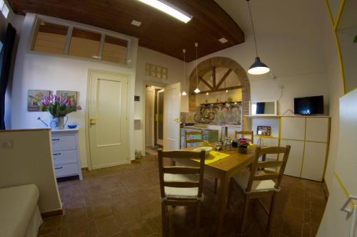 a kitchen and dining room with a table and chairs at A Casa Di Agata in Pellezzano