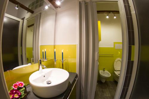 a bathroom with a sink and a tub and a toilet at A Casa Di Agata in Pellezzano