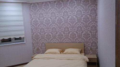 Postel nebo postele na pokoji v ubytování Baku Butik Mini-Hotel