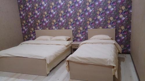 Postel nebo postele na pokoji v ubytování Baku Butik Mini-Hotel