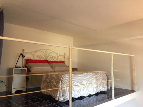 a bedroom with a bed with a metal frame at Villa Li Schisani in Sorrento