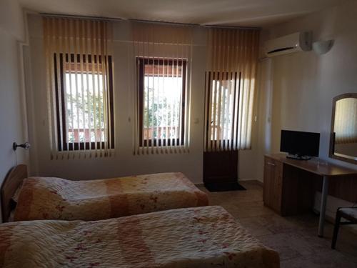 מיטה או מיטות בחדר ב-Studios Sea View