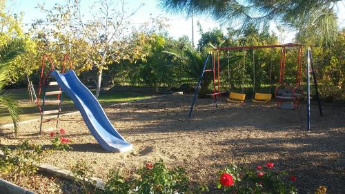 a playground with a slide in a park at Alojamiento Rural VillaSol in La Piedra de la Sal