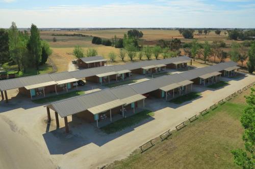 an overhead view of a row of buildings with trees at Hilltop Resort in Swan Hill