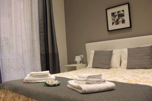 Ένα ή περισσότερα κρεβάτια σε δωμάτιο στο Spazio Cavour Guesthouse