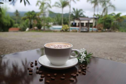 a cup of coffee sitting on top of a table at Kamayan sa Palaisdaan in Lucban