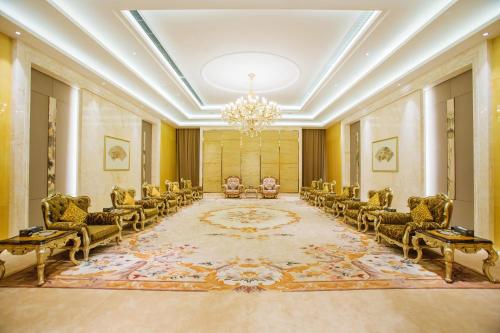 a large room with chairs and a chandelier at JinLing Hotel SanFangXiang in Jiangyin