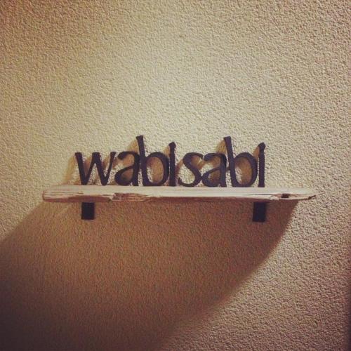 a wooden shelf with the word waldorf on a wall at Retreat wabi-sabi - walk to Ohama Beach - Max 12 ppl in Shimoda