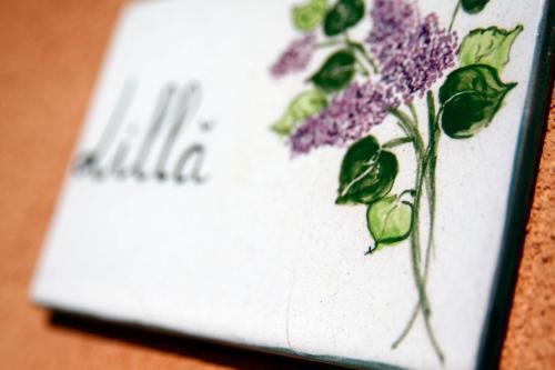 a book with a drawing of a flower on it at Rustico del Conero in Camerano