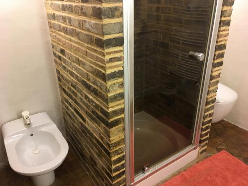 a bathroom with a toilet and a shower at Demeure des Vieux Bains in Provins